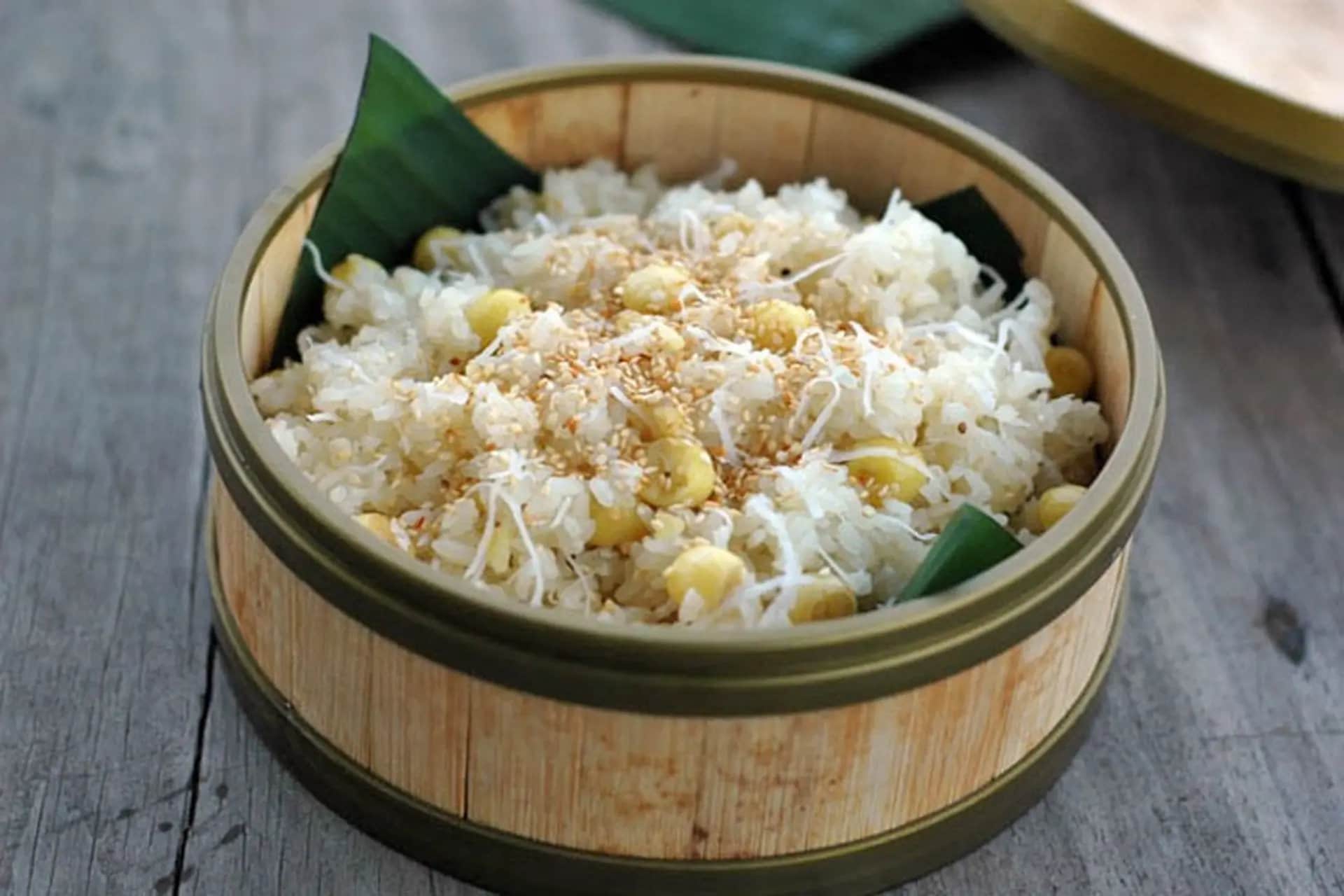 Coconut xoi blends sticky rice with grated coconut and sesame, offering a mildly sweet and aromatic flavor